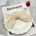 Champagne oversized organza bow hair clip with pearlescent finish for women - Ice Cream Beige