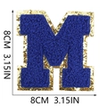 Detailed size view of blue chenille letter M patch with gold sequins border - Letter M
