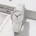 Detail of white quartz watch featuring a unique wavy silicone strap and minimalist dial - White