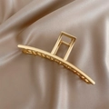 Macro detail of matte gold metal hair claw clip on champagne silk background - Gold Bar Clip