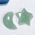 Macro shot of natural green crystal carvings in star and moon shapes for home decor - Star and Moon / Green Aventurine