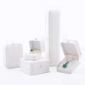 Elegant white jewelry box set with gold crown emblem for rings and necklaces - White