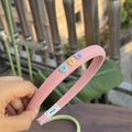 Pink twill fabric headband with three colorful buttons and Alline brand woven label - Sakura Pink Narrow Headband with Multi-Color Buttons