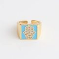 Detailed view of gold-plated Hamsa ring with blue enamel and cubic zirconia accents - Adjustable Open / Sky Blue