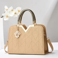 Elegant beige tote bag with 3D geometric embossing and woven black-gold handle - Gold