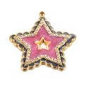 Makroaufnahme von Goldstern-Anhänger mit rosa Glitzer-Emaille und Strasssteinen - Schwarz-Rot
