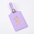 Close-up of light purple PU leather luggage tag with gold foil world map pattern and buckle - Purple