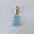Light blue gummy bear pendant necklace with sparkling crystal ring on white background - Candy Bear Blue