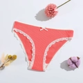 Detailed view of coral pink ribbed cotton panties with delicate white lace trim and bow - Hot Pink