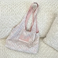 Detail of floral canvas tote bag featuring lace trim and vintage gingham pocket design - Pink