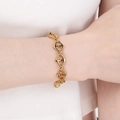 Polished gold stainless steel geometric link bracelet on model's wrist with minimalist style - Anchor Chain Style / Gold (KB204033-ZCG)