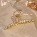 Pince à Cheveux Croisée en Perles Dorées
