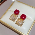 Detail view of red oval zircon stud earrings with square diamond inlay in a gift box - Silver Pin Square Style (WE5718)