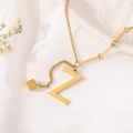 Detail of gold-plated chain featuring a letter Z pendant and small cube charm - Gold Initial Z (8847)