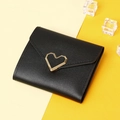Detailed view of black leather wallet with a golden heart-shaped metal clasp buckle - Black