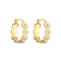 Detail of gold daisy hoop earrings with white enamel petals and yellow center - White Hoop Earrings / 1 Pair