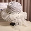 Elegant white straw hat with lace bow and pearl detail for summer sun protection - White