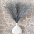 Detail of fluffy dark grey faux pampas grass bouquet in a minimalist white ceramic vase - Dark Gray