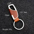 Brown leather car keychain with metal carabiner and dimensions shown on black background - Brown Leather Hook (GD-345)