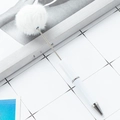 Creative DIY beadable ballpoint pen featuring a fluffy white faux fur pompom decoration - White