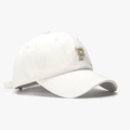White cotton baseball cap featuring beige embroidered letter P with curved brim details - White
