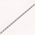 Detail of silver tennis bracelet with alternating clear and blue cubic zirconia stones - Platinum Plated - White & Aquamarine