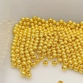Macro shot of 14k gold-filled solid round loose beads for DIY jewelry making accessories - 2mm (0.8mm hole) / Gold