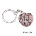 Pink Rhodonite heart pendant keychain with silver-polished metal ring on white background - Rhodonite