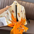 Elegant orange and beige silk-feel scarf with butterfly and gold chain horsebit prints - Orange