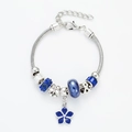 Detail of silver snake chain bracelet with blue enamel flower charms and crystal beads - Dark Blue Floral Bracelet