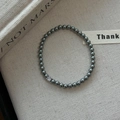 Bracelet élégant en perles gris foncé métallisées avec un zircon blanc étincelant - Bracelet Simple En Perles Métalliques Gris Foncé Avec Un Seul Strass