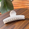 Detail of cream marbled hair claw clip on a dark wood table with soft natural lighting - 11.5CM / Off-White