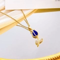 Elegant gold tulip necklace featuring blue cat-eye stone and micro-pave zircons - Royal Blue Cat Eye Necklace / Gold