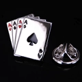 Detailed view of silver poker Ace brooch set with red and black enamel on black background - Four Aces Poker