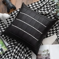 Close-up of black leather cushion cover with white stripes and metal hardware accents - Black Series Faux Leather Pillow Cover 01