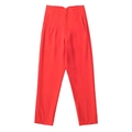 Detail view of red high-waisted tapered trousers featuring side pockets and a clean finish - XS / Orange Red