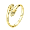 Detailed close-up of golden hug-shaped adjustable ring with polished metal finish - Gold