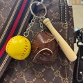 Detail of yellow baseball, leather glove and wooden bat keychain hanging on a stylish bag - 3.5CM Yellow Ball Brown