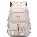 Detail of light grey multi-pocket backpack with leather logo and decorative pins - Bare Bag / Carmine