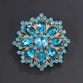 Elegant snowflake brooch with deep blue crystals and gold-plated alloy base - KC Gold, Peacock Blue