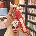 Cartoon Santa Claus PVC keychain with red Merry Christmas silicone wrist strap and gold ring - Kissing Santa Claus (Gold Keychain)