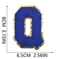 Detail of royal blue chenille letter Q patch with gold glitter edge and 8cm measurements - Letter Q