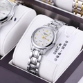 Detail of ORUSS 1853 quartz watch featuring dual calendar and luxury crystal markers - Silver Band White Dial