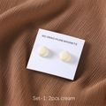 Macro detail of two cream no-snag magnetic hijab pins on white display card packaging - Cream (SET-1)