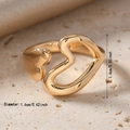 Close-up of golden heart open ring with dimension labels on textured stone surface - Gold Heart Open Ring / KC Gold