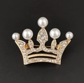 Detail of gold crown brooch with white pearls and sparkling rhinestones on black background - 5-Pearl Gold Crown
