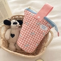 Detail of pink plaid quilted pencil case with blue zipper and rose rosy label - Red