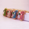 Set aus vier bunten Strass-Krokodil-Schlüsselanhängern in Grün, Champagner, Blau und Rosa - Mehrfarbig