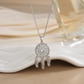 Elegant dreamcatcher pendant necklace with sparkling rhinestones on a white ceramic tray - Silver Rhinestone Hollow Dreamcatcher