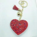 Llavero corazón rojo de cuero con pedrería, borla dorada y colgante de campana - Tono Dorado + Base Roja Color Mezclado